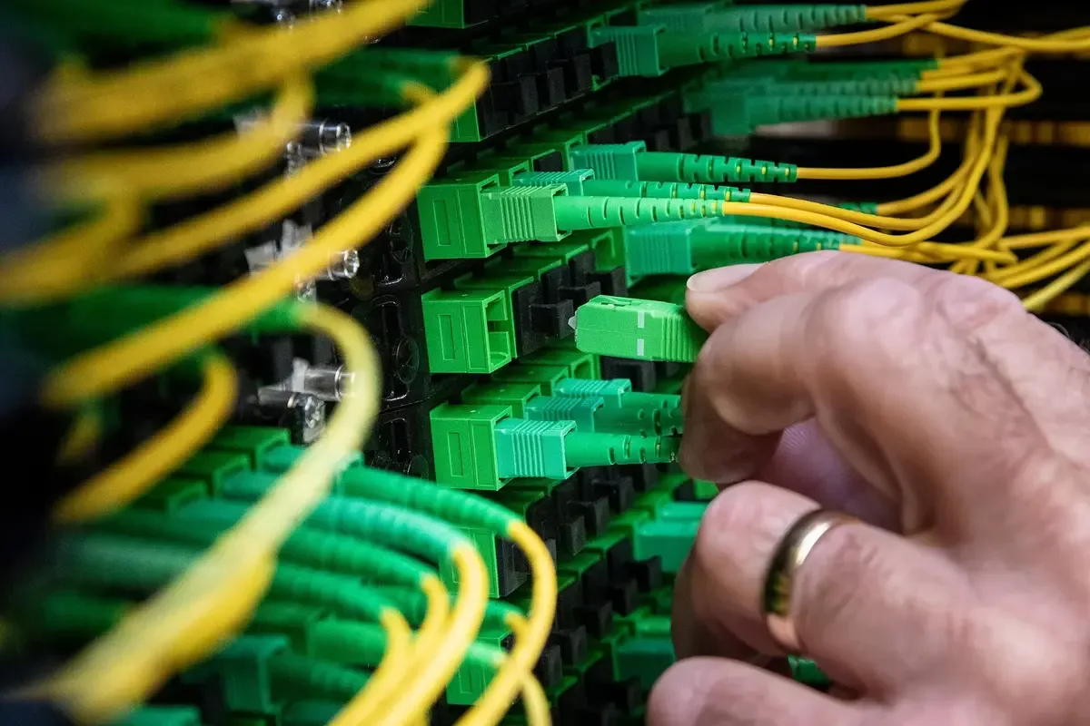 Technician terminating fiber patch cables